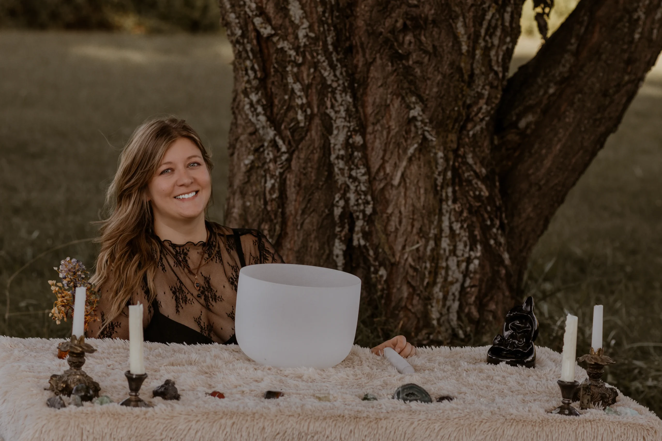 Kristen seated at a table in a calm, welcoming setting.