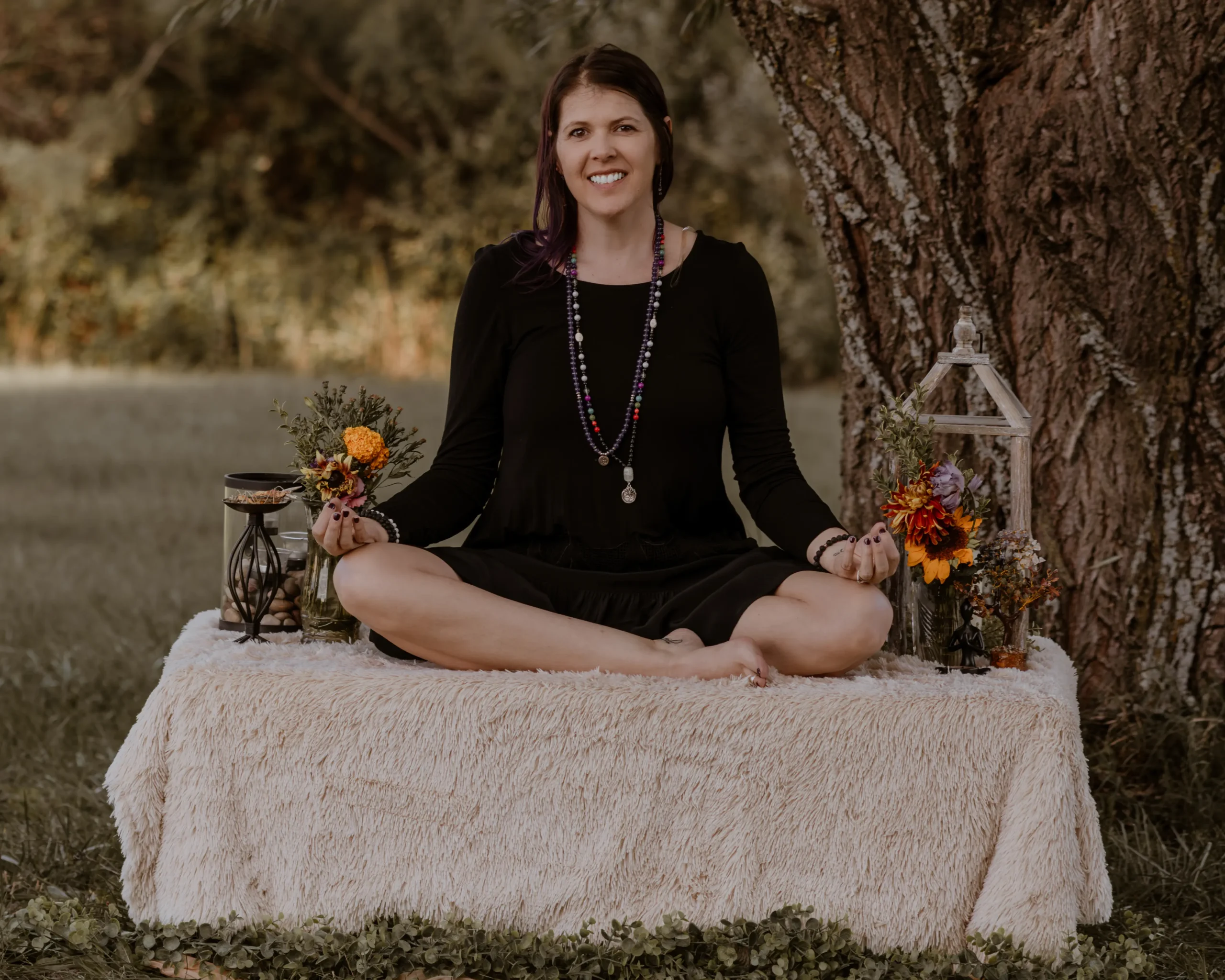 Mandi seated at a table in a bright, welcoming setting.